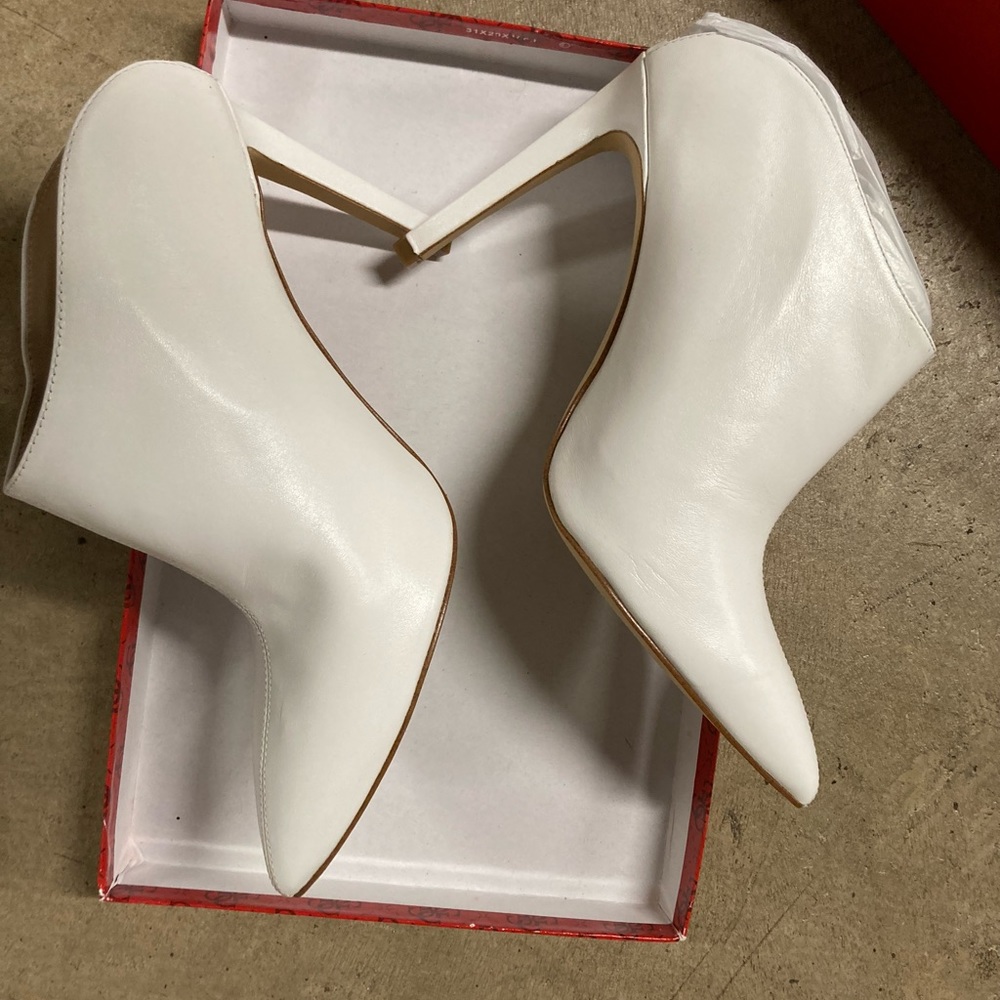 White heels, back out sleek and say shoes